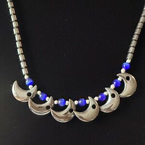 Hematite and Blue cat’s eye Crescent Necklace